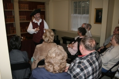 Members listening to the costumed interpreter